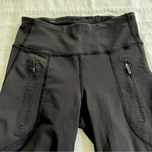 Lululemon black mesh leggings size 4 with mesh design on leg